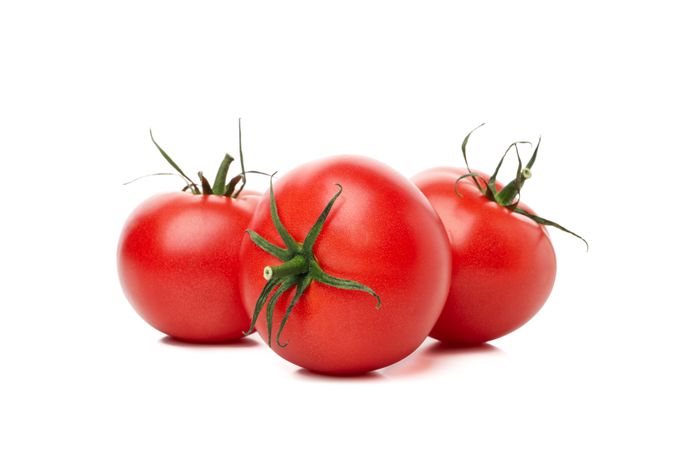 Fresh ripe tomatoes isolated on plain background