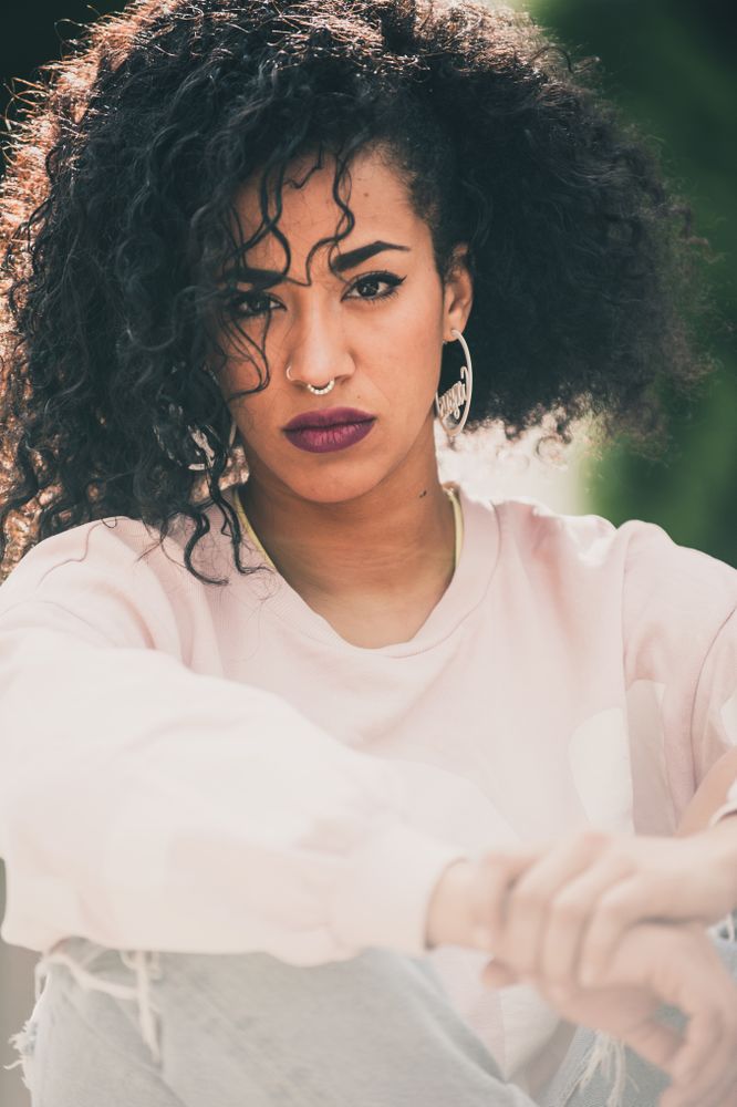 Portrait of modern Black woman with curls