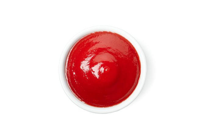 Bowl of tomato sauce isolated on blank background
