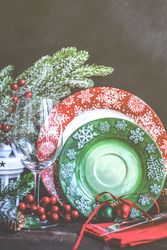 Green and red plates for Christmas season presented on table