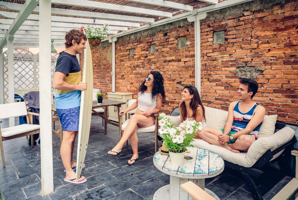 Group of people relaxing after surf class