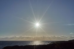 Sun shining over ocean