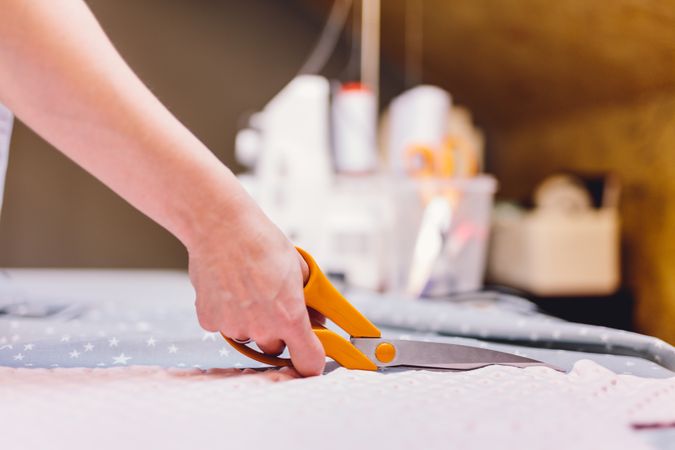 Crop hand cutting fabric