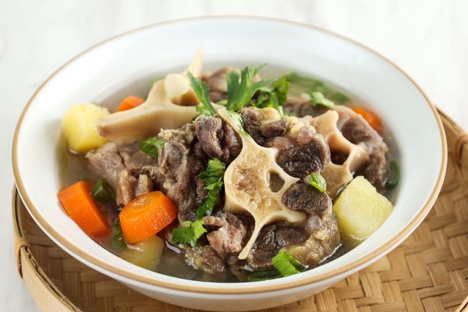 Indonesian Oxtail Clear Soup or Sop Buntut with Potato and Carrot