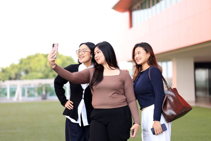 Three College Student Take Selfie Photo Group using Mobile Phone
