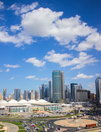 City buildings under blue sky in Sharjah, UAE
