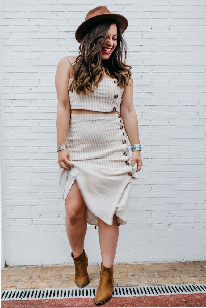 Woman smiling standing in white background
