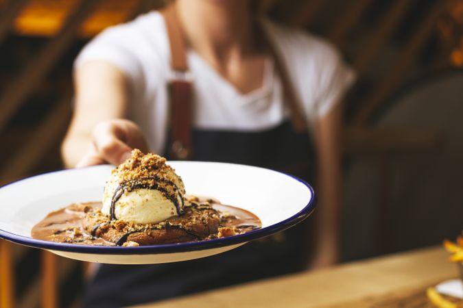 Tasty sweet burger with chocolate crumb and nuts