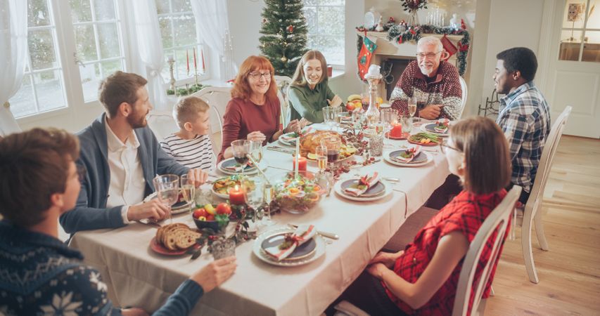 Family, Children, Friends and Young Couples Gather at Home for a Festive Christmas Dinner