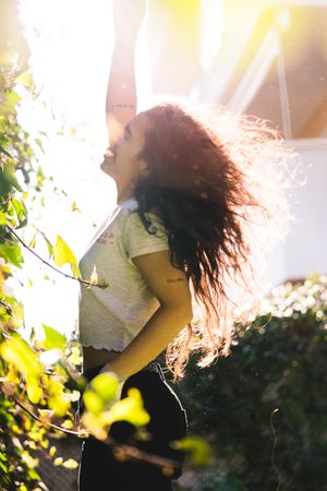 Cheerful woman in garden