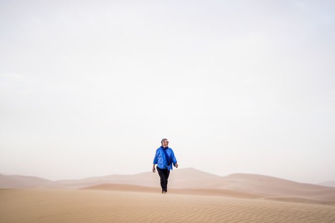 Mature man walking in desert