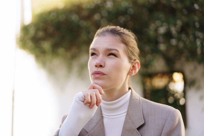 A Thoughtful Young Woman Dressed in Stylish Business Attire, Reflecting on Lifes Opportunities