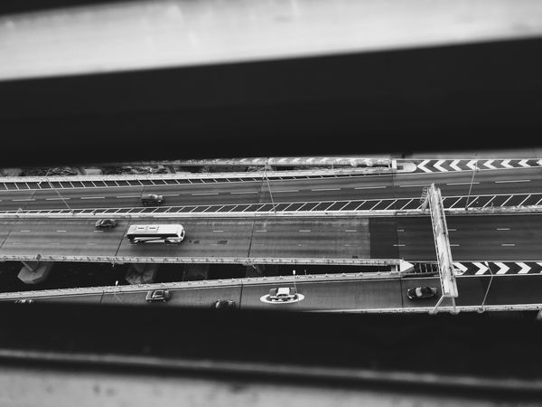 Monochrome top view of highway with vehicles