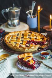 Baked pie with cherry filling on table with tea cup 4BQlP5