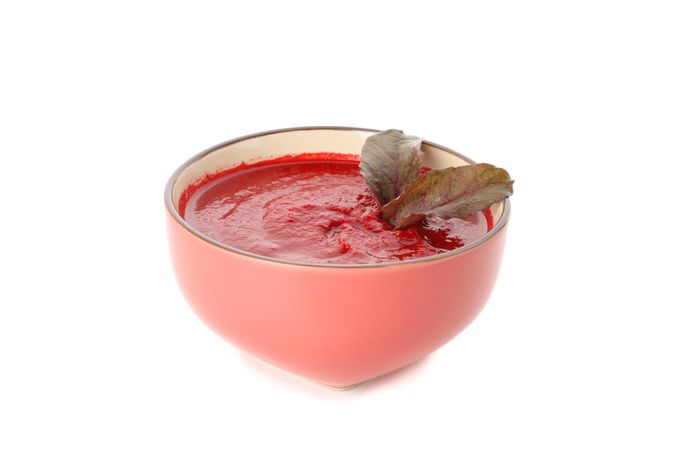 Bowl of tomato in plain studio shoot