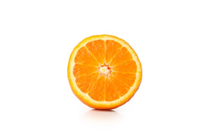 Half of ripe mandarin isolated on light background