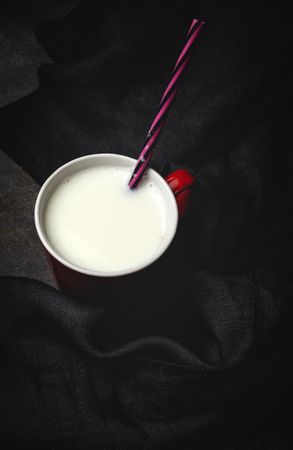 Cup of milk on table