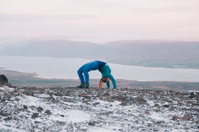 Woman posing on hill in snow