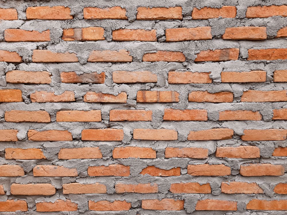 Old Red Brick Wall with Cement Mortar Texture for Architecture Background