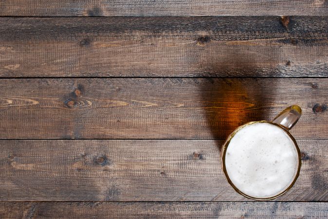 Top view of beer on wooden table