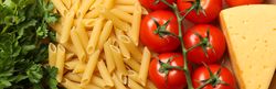 Composition with pasta and ingredients for cooking on craft paper background