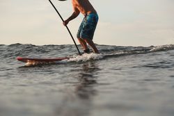 Man on surf board on water surface