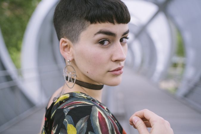 Woman in colorful shirt posing