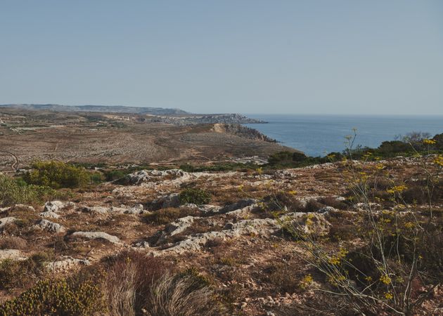 Looking over cliffs in Malta around the Mediterranean Sea