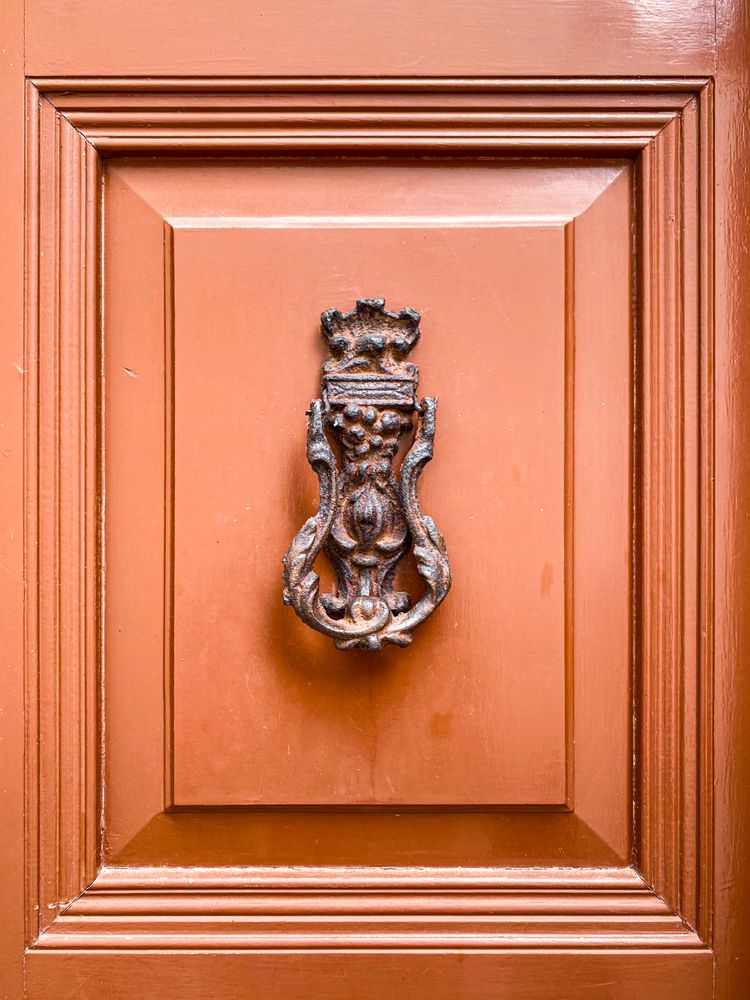 Patmian knocker of rusty medieval family crest