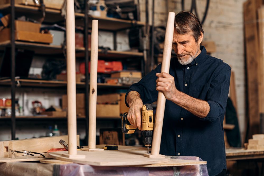 Man using powertools on table