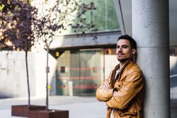 Stylish man outside modern building
