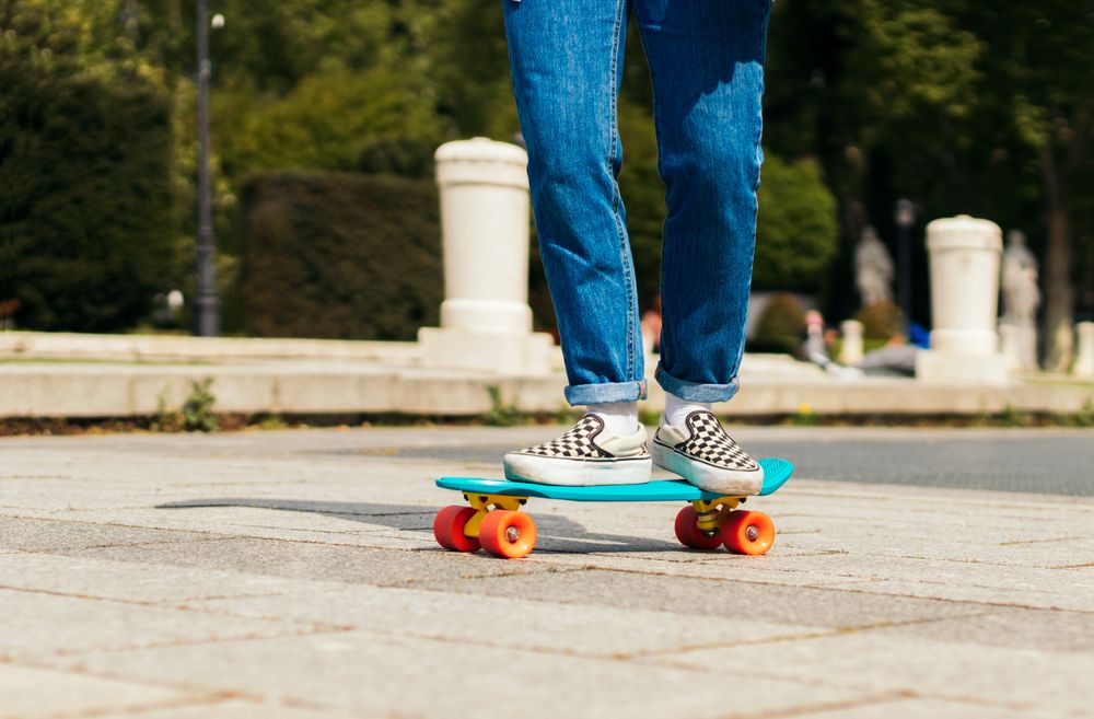 woman skating on a city square. close-up
