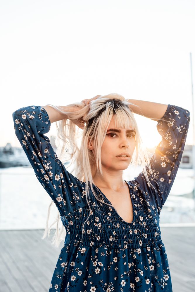 Woman looking at camera during sunrise