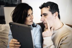 Couple in Virtual Medical Consultation for Health Monitoring, Featuring Eye Examination at Home