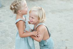 Cheerful children playing on beach