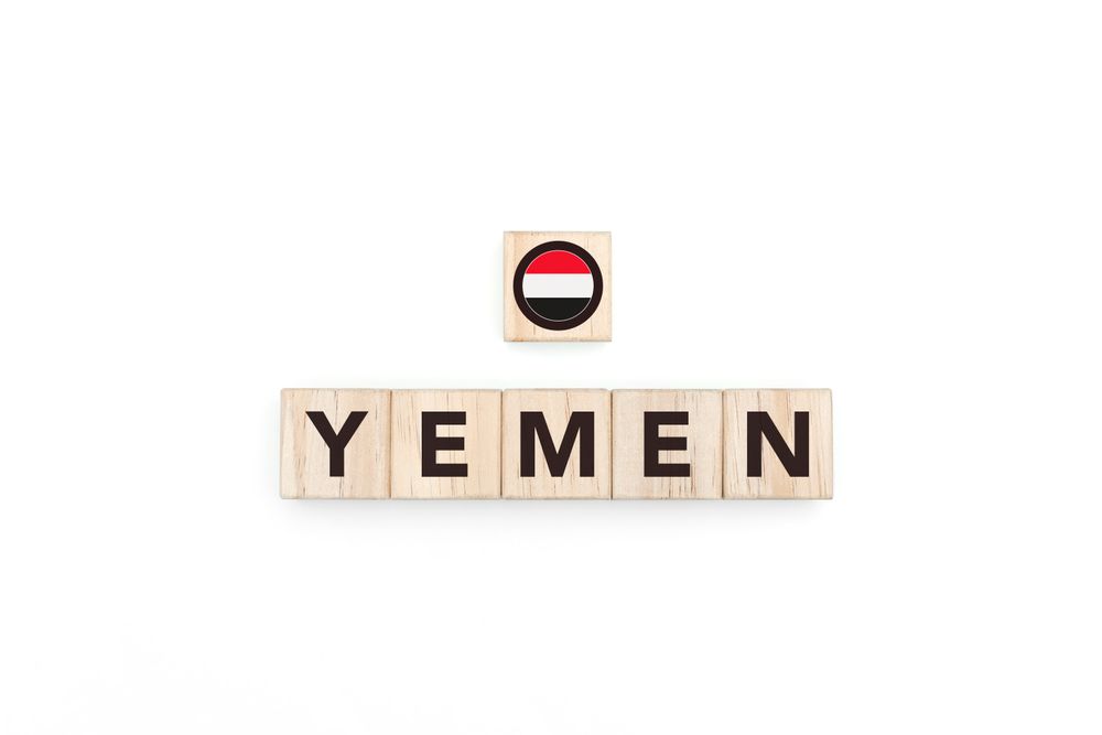 Wooden blocks bearing the name and flag of Yemen.