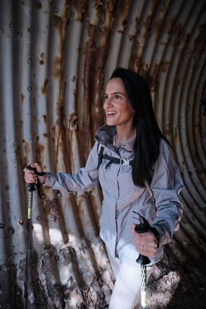 Positive Hispanic hiker in desolated tunnel