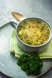 Hearty chicken soup on napkin