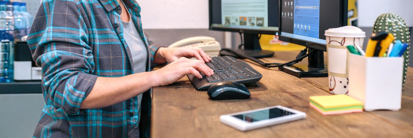 Unrecognizable woman checking orders received by ecommerce shop