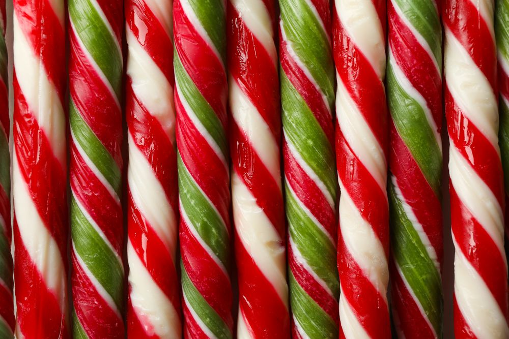 Candy canes texture on whole background, close up