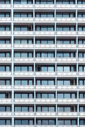 Hotel building with a lot of balconies and windows, vertical