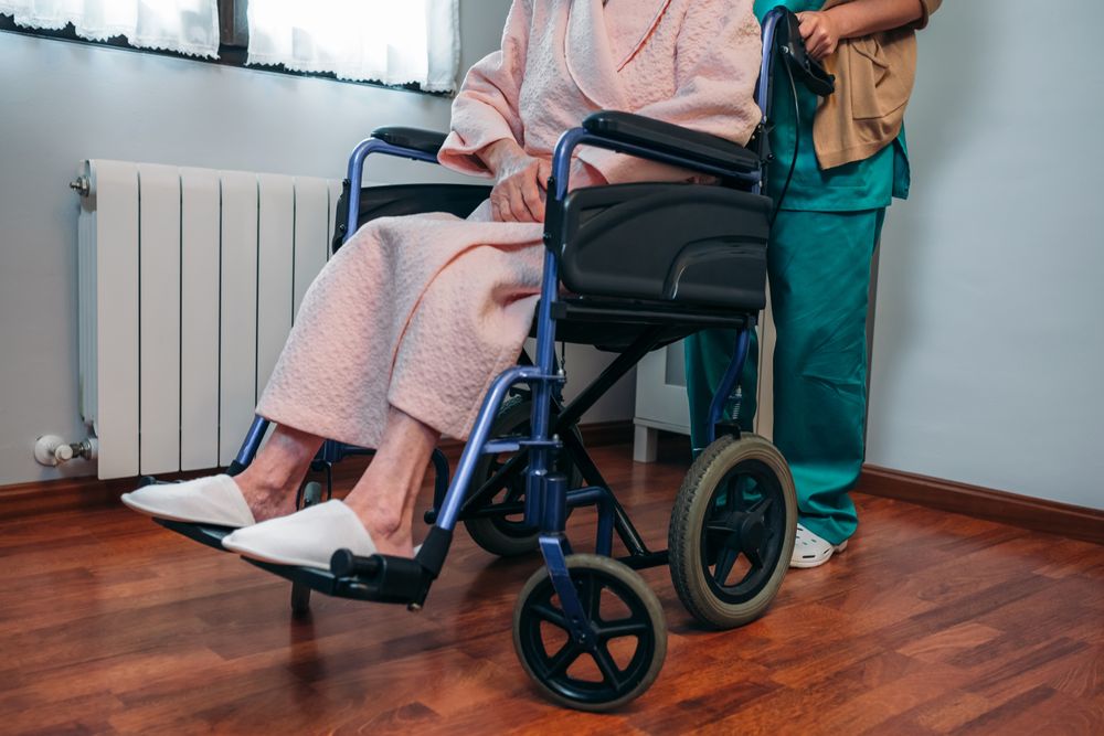 Doctor pushing patient in a wheelchair