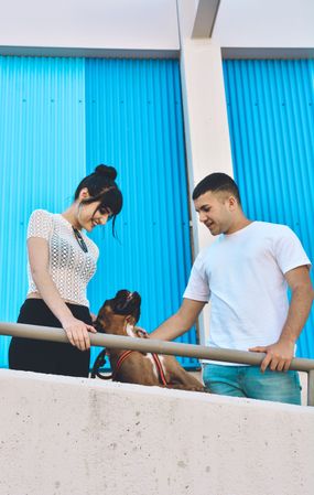 Couple with their Boxer dog.