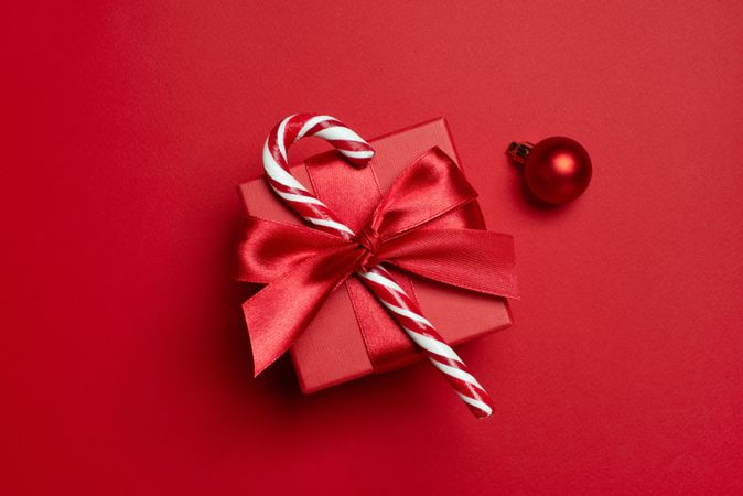 Red present with bow, candy cane and bauble