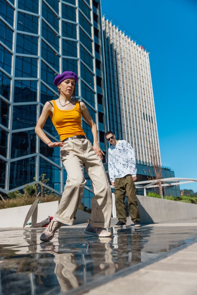 Vertical Screen: Young And Stylish Female Hip Hop Dancer Freestyling On Street In the Circle Of Fashionable Friends.