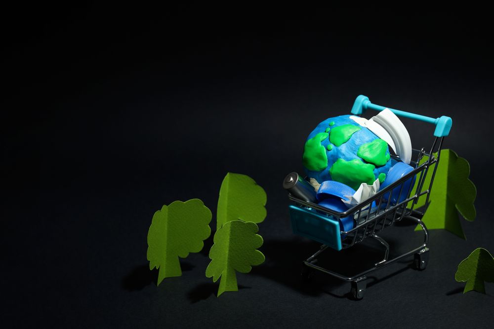 Globe in shopping cart with copy space