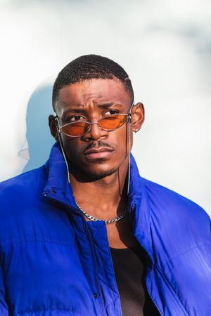 Stylish Black man in sunglasses on street