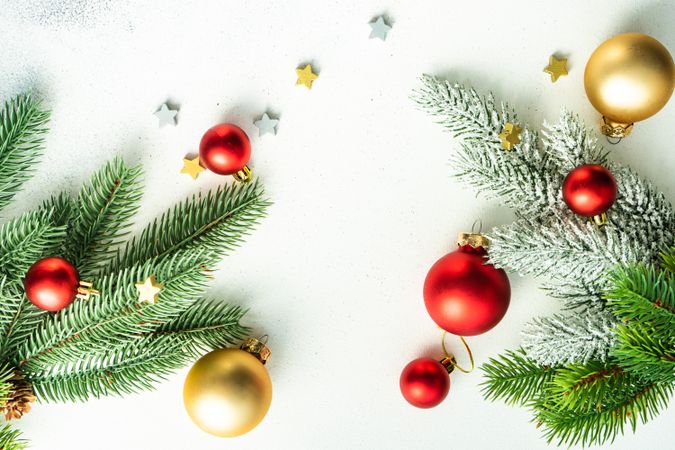 Top view of counter with fir branch and holiday baubles