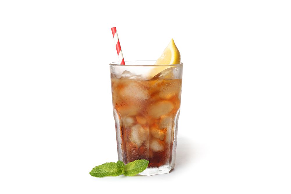 Glass of cold cola with lemon isolated on blank background