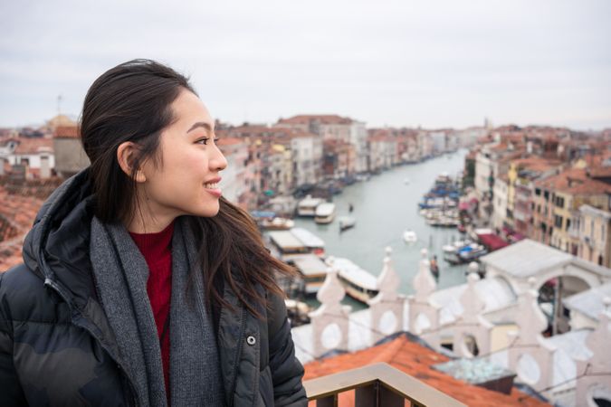 Content Asian female tourist at old city with waterlines